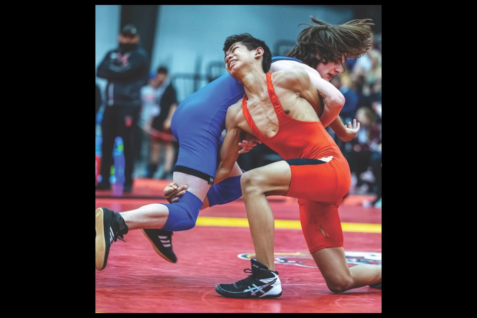 Elphinstone Secondary School Grade 9 student Ethan Sullivan (in blue) came home with three medals from the national wrestling championships in Calgary earlier this month. 